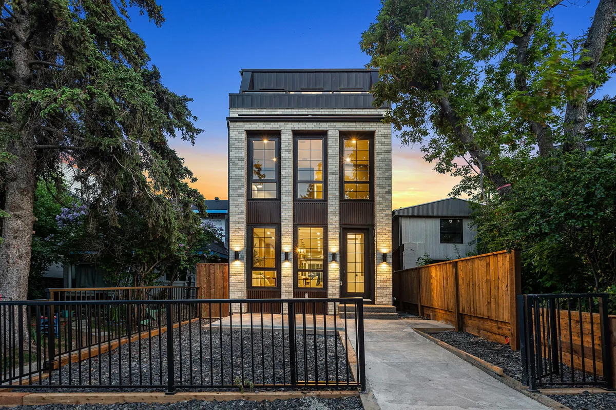 A new inner-city home at dusk, seen from the lane